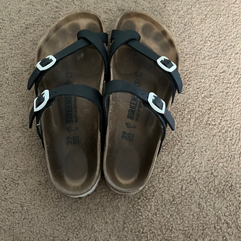 Black and white Birkenstock sandals